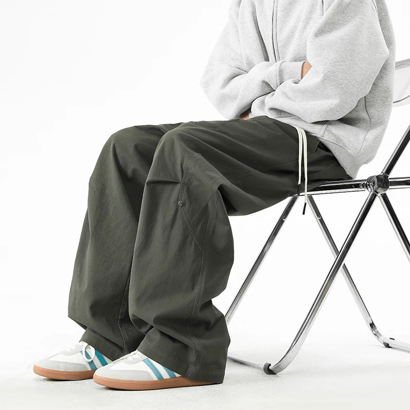 Mens Sold Cargo Pants High Street Rivet decorative Comfortable Loose Fit Wide Leg Pants Man Workwear Drawstring Waist Trousers 250321