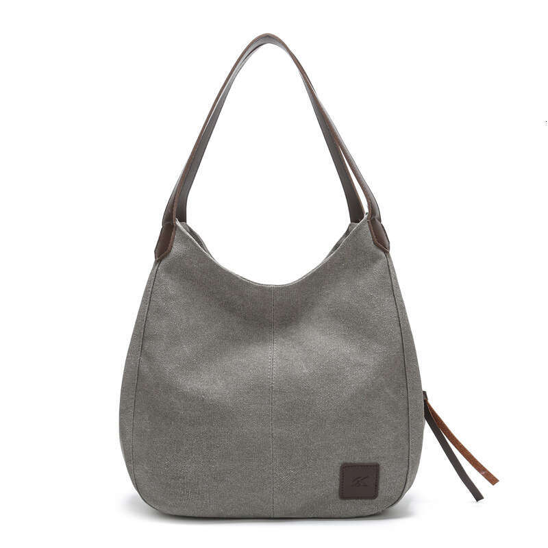 2025 new canvas women's bag, fashionable versatile, artistic and simple Korean version, single shoulder handbag, multiple compartments, casual la