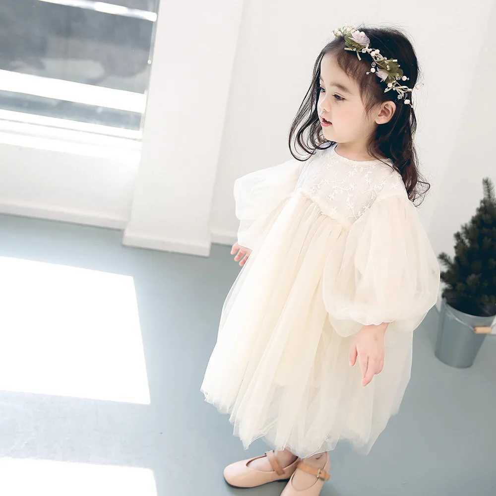 The charming girl Par is wearing a chic fluffy sleeve dress made of sheer fabric perfect for birthday celebrations and childrens dresses W250326