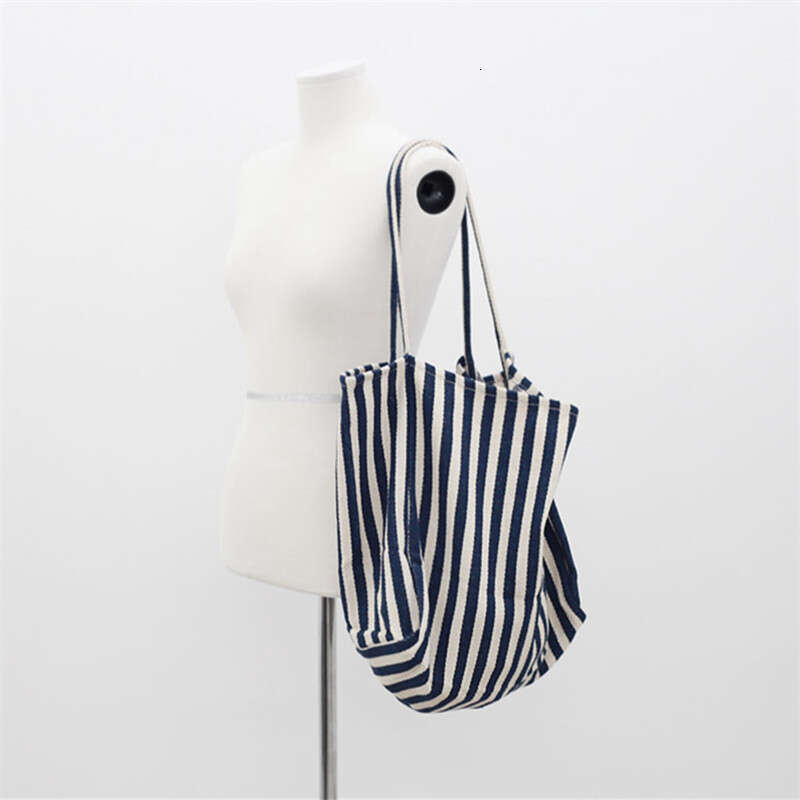 Korean version of artistic handbag, simple fresh, striped canvas bag, versatile and casual, large capacity single shoulder women's bag