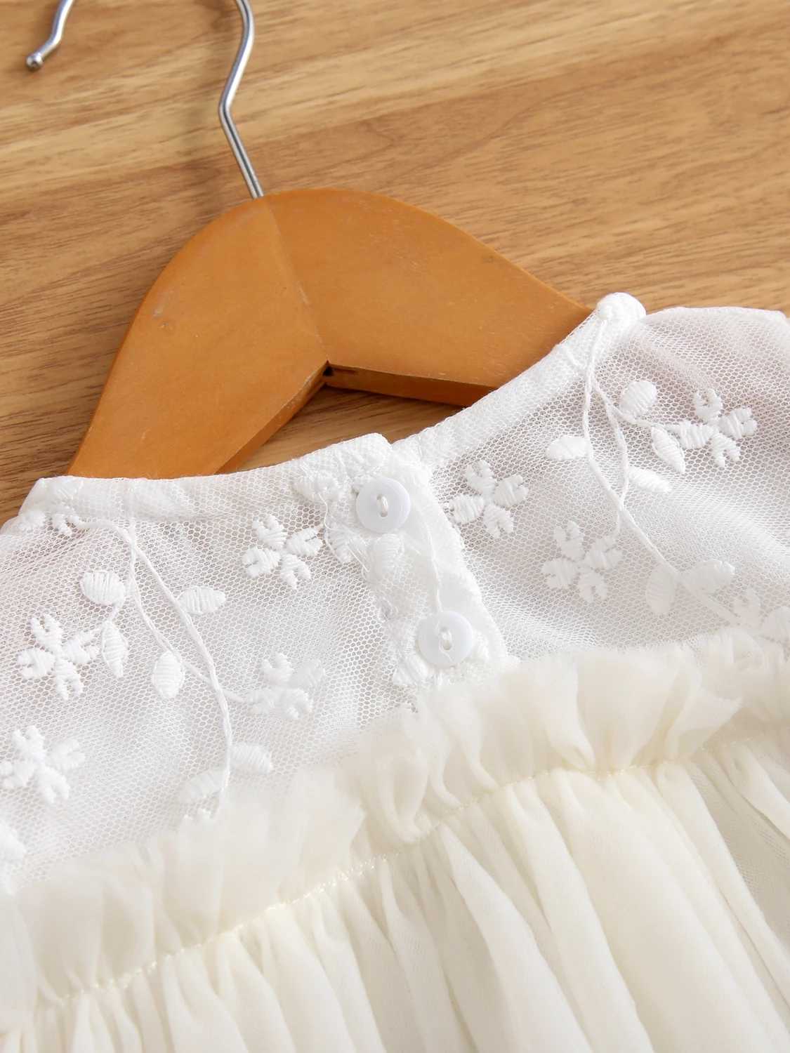The charming girl Par is wearing a chic fluffy sleeve dress made of sheer fabric perfect for birthday celebrations and childrens dresses W250326