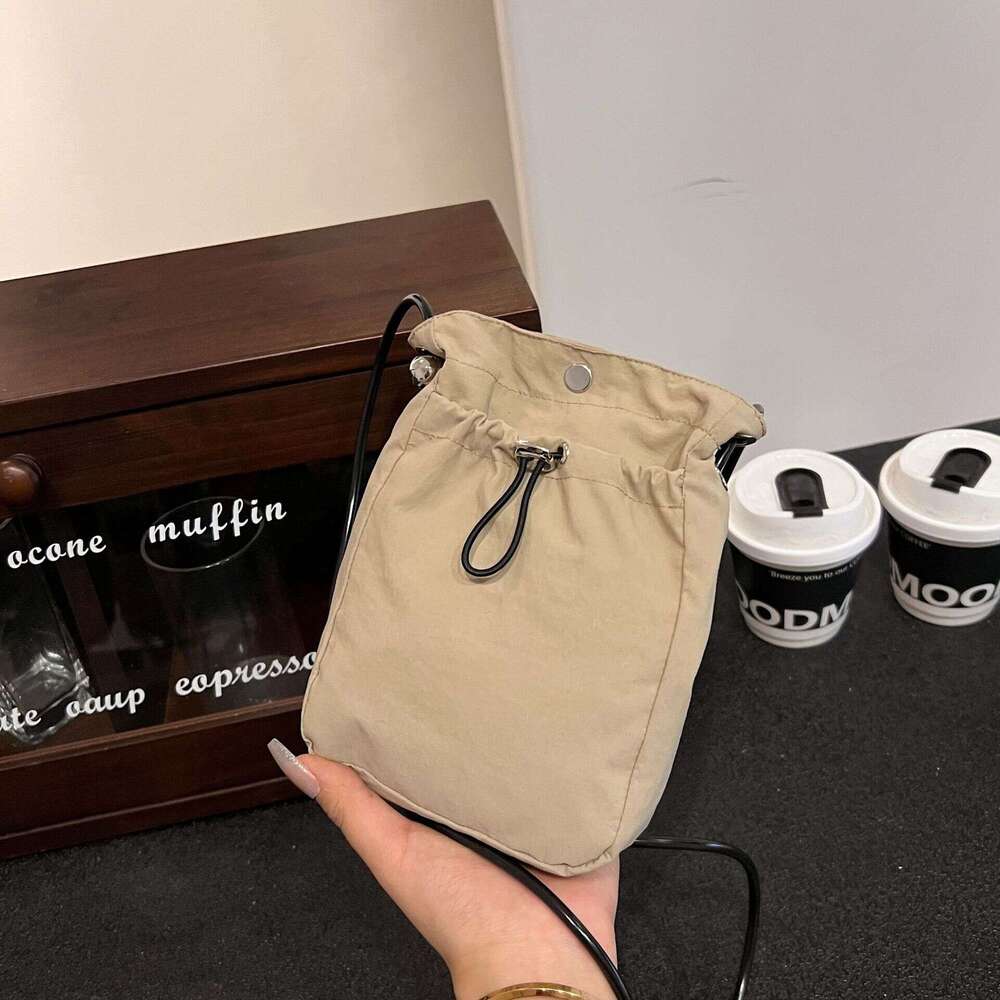 Minimalist style mobile phone bag for women, Japan and South Korea, lightweight drawstring canvas small bag, versatile mini one shoulder crossbody zer