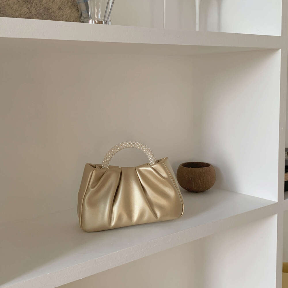 French pleated 2025 high-end feeling fairy like pearl small handbag gentle wind crossbody cloud bag for women