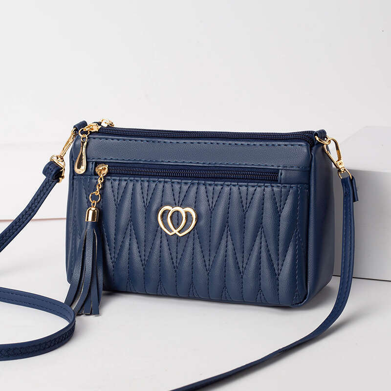 Mom's middle-aged high-end small mini crossbody bag, women's niche tassel soft leather mailman's bag