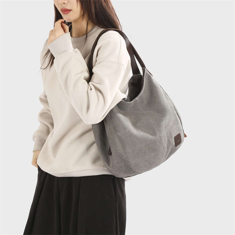 2025 new canvas women's bag, fashionable versatile, artistic and simple Korean version, single shoulder handbag, multiple compartments, casual la