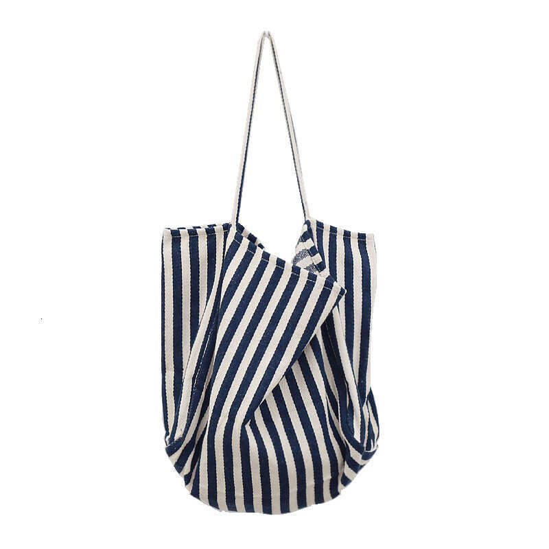 Korean version of artistic handbag, simple fresh, striped canvas bag, versatile and casual, large capacity single shoulder women's bag