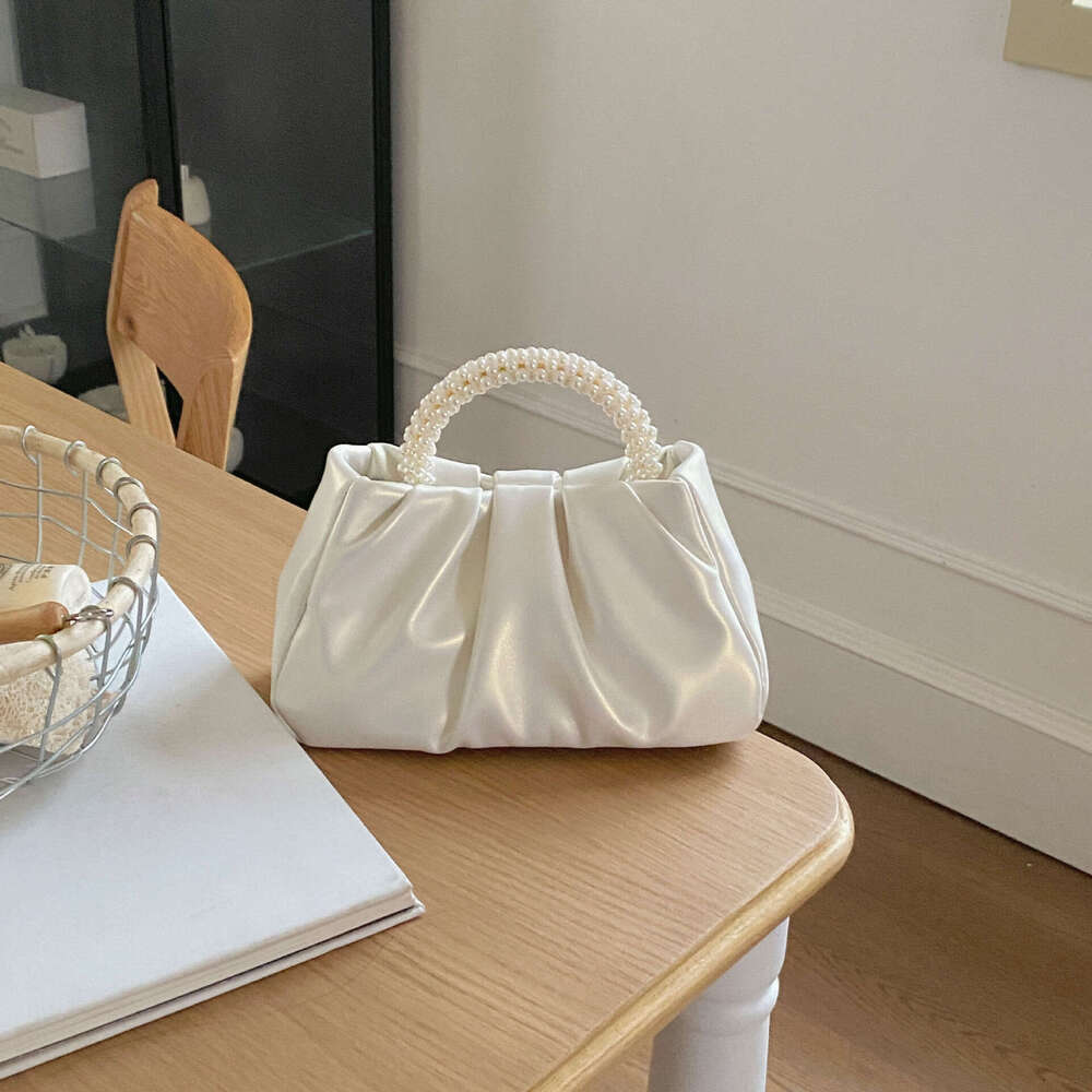 French pleated 2025 high-end feeling fairy like pearl small handbag gentle wind crossbody cloud bag for women