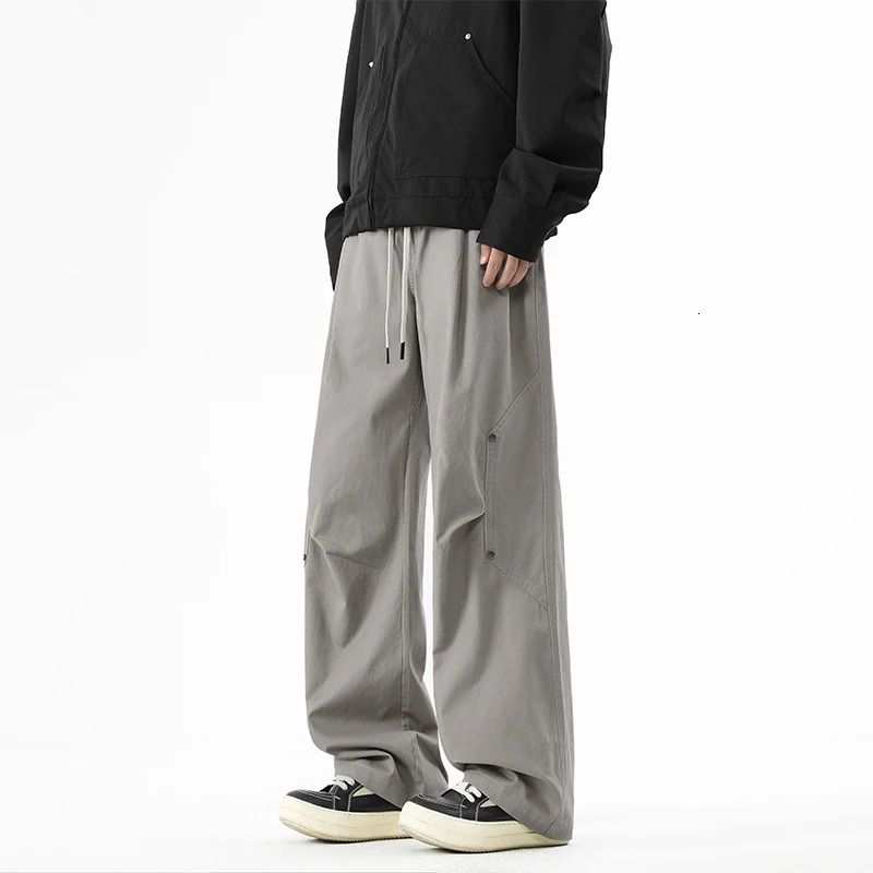 Mens Sold Cargo Pants High Street Rivet decorative Comfortable Loose Fit Wide Leg Pants Man Workwear Drawstring Waist Trousers 250321