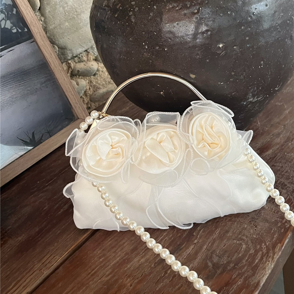 Designer 2025S pearl flower fairy mesh handbag women gentle style shoulder crossbody sweet and fresh small bag
