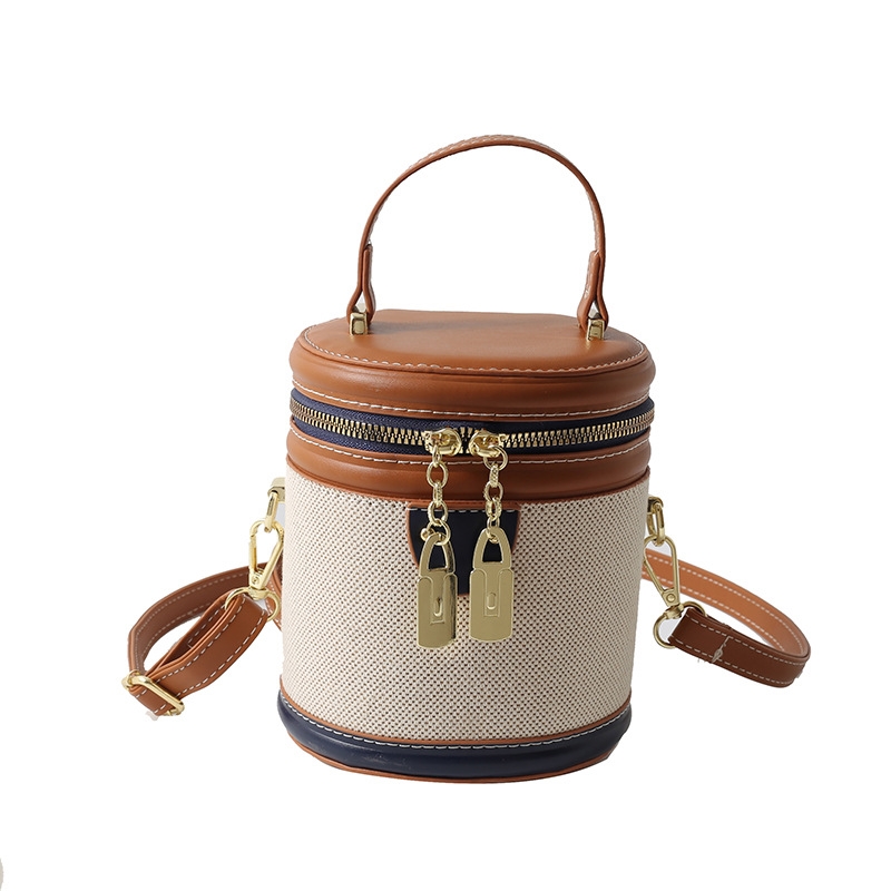 Free shipping retro bucket bag Women's portable fashion color contrast cylinder bag High appearance level exquisite single shoulder crossbody bag