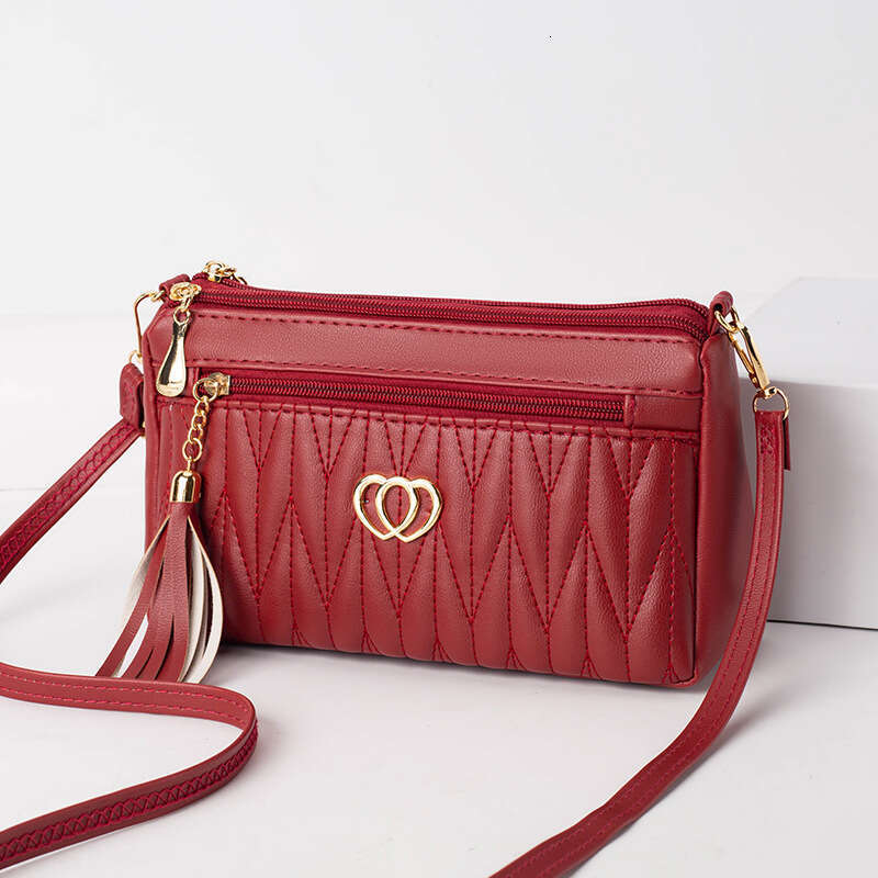 Mom's middle-aged high-end small mini crossbody bag, women's niche tassel soft leather mailman's bag
