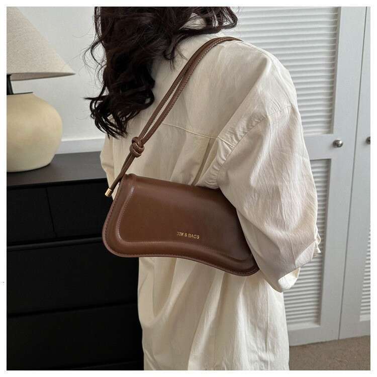 Advanced armpit artistic style shoulder niche irregular small square bag, gentle and simple hand-held bag