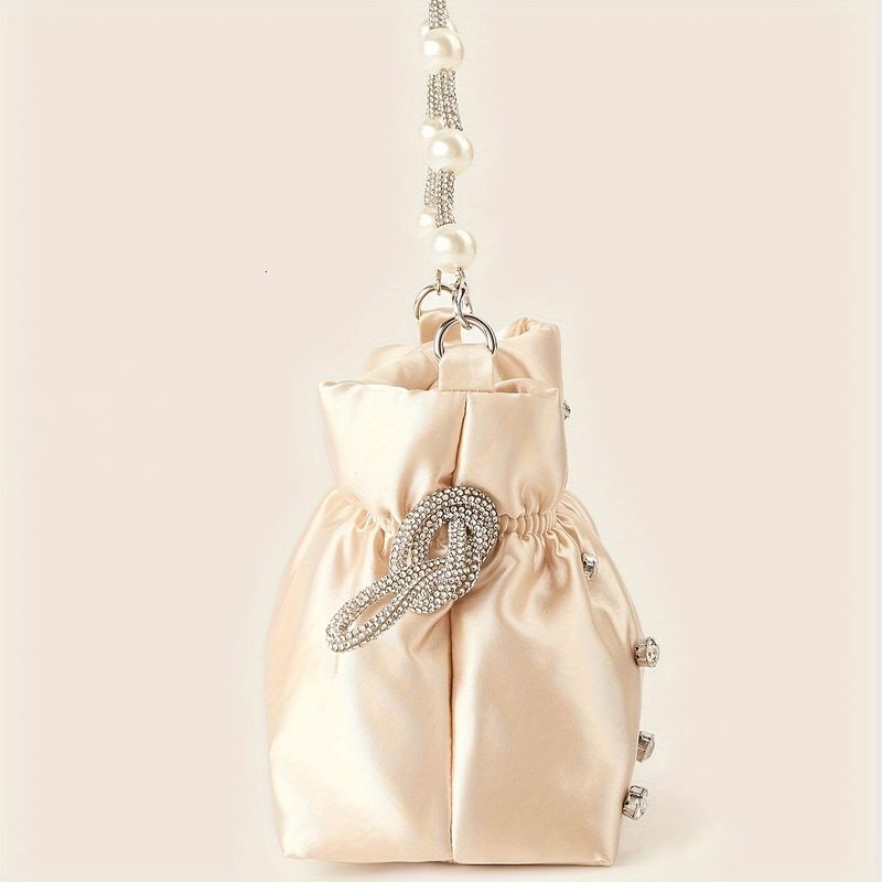 Elegant Solid Color Clutch With Rhie Accents And Pearl Handle