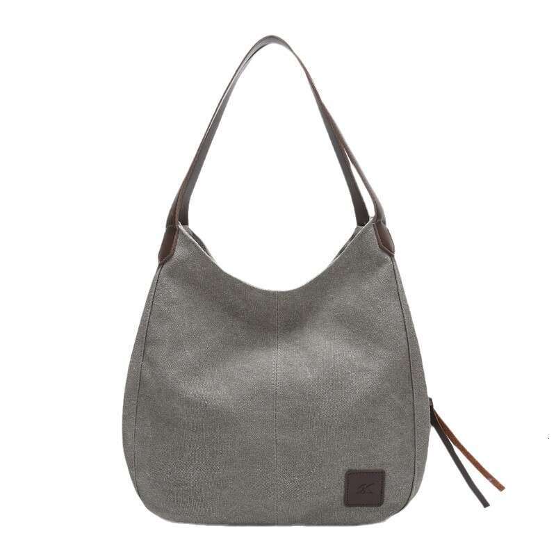 2025 new canvas women's bag, fashionable versatile, artistic and simple Korean version, single shoulder handbag, multiple compartments, casual la
