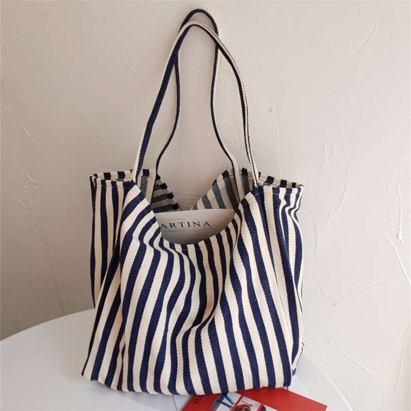 Korean version of artistic handbag, simple fresh, striped canvas bag, versatile and casual, large capacity single shoulder women's bag