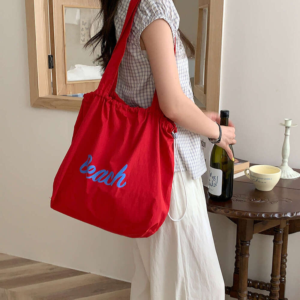 Korean version new letter printed women's large capacity nylon shoulder casual versatile portable drawstring tote bag