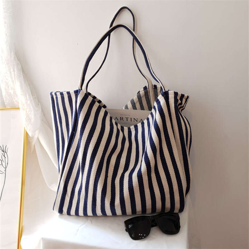 Korean version of artistic handbag, simple fresh, striped canvas bag, versatile and casual, large capacity single shoulder women's bag