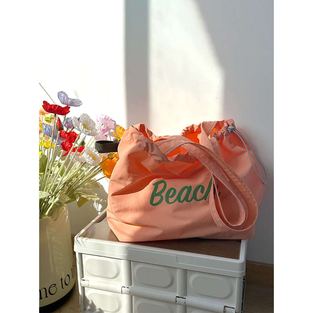 Korean version new letter printed women's large capacity nylon shoulder casual versatile portable drawstring tote bag