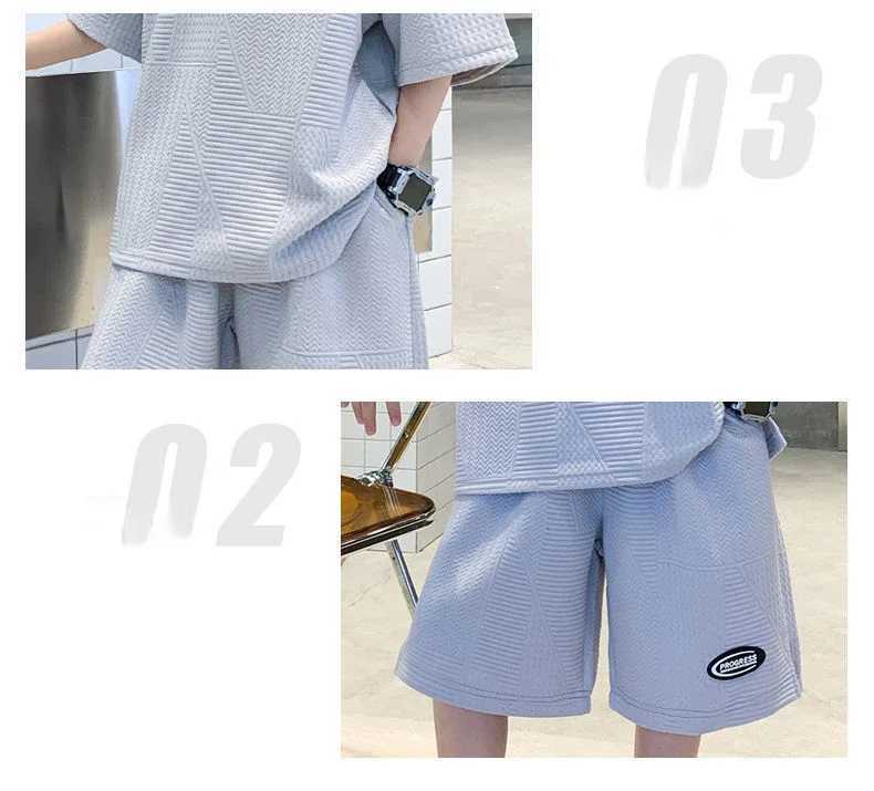 Provide childrens track and field clothing for ages 7 to 16 featuring a simple round neck design short sleeved top and loose shortsT250327