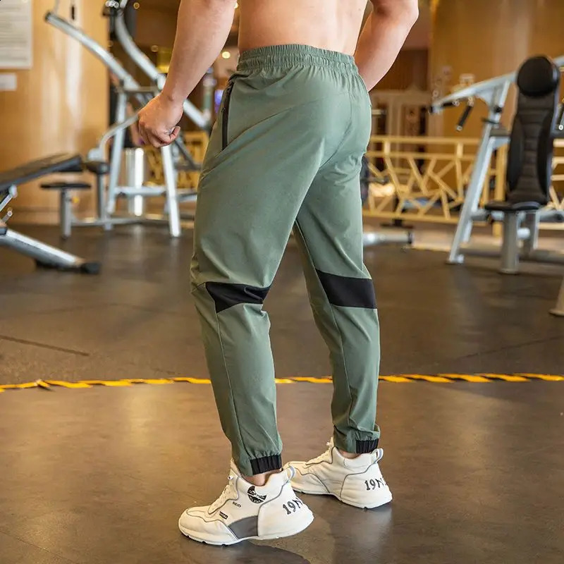 2024 Summer Thin Style Ice Silk Fabric Motion Trousers Man Solid Color Elastic Waist Quick Drying Loose Bodybuilding Sweatpants 250317