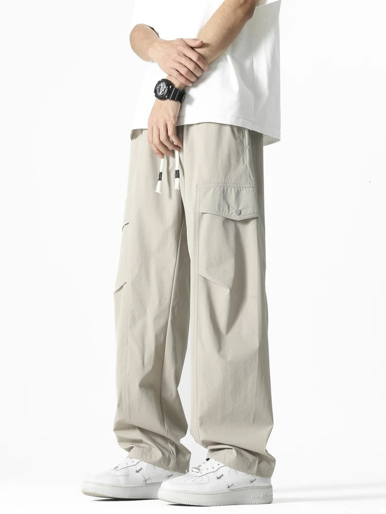 Mens straight casual pants Korean style multi pocket commodity drawstring wide leg sports outdoor loose fit suitable for mens clothing 250327