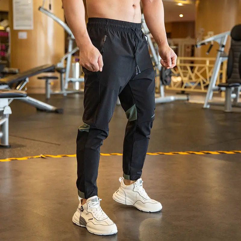 2024 Summer Thin Style Ice Silk Fabric Motion Trousers Man Solid Color Elastic Waist Quick Drying Loose Bodybuilding Sweatpants 250317