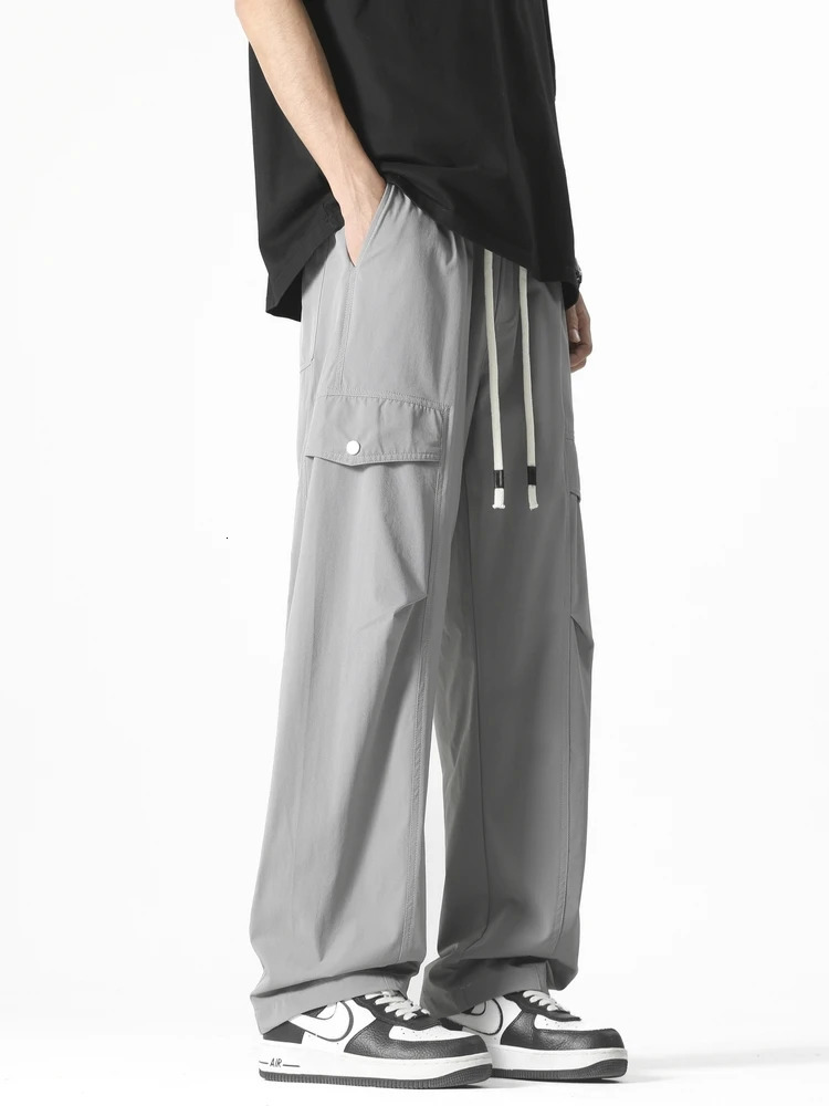 Mens straight casual pants Korean style multi pocket commodity drawstring wide leg sports outdoor loose fit suitable for mens clothing 250327