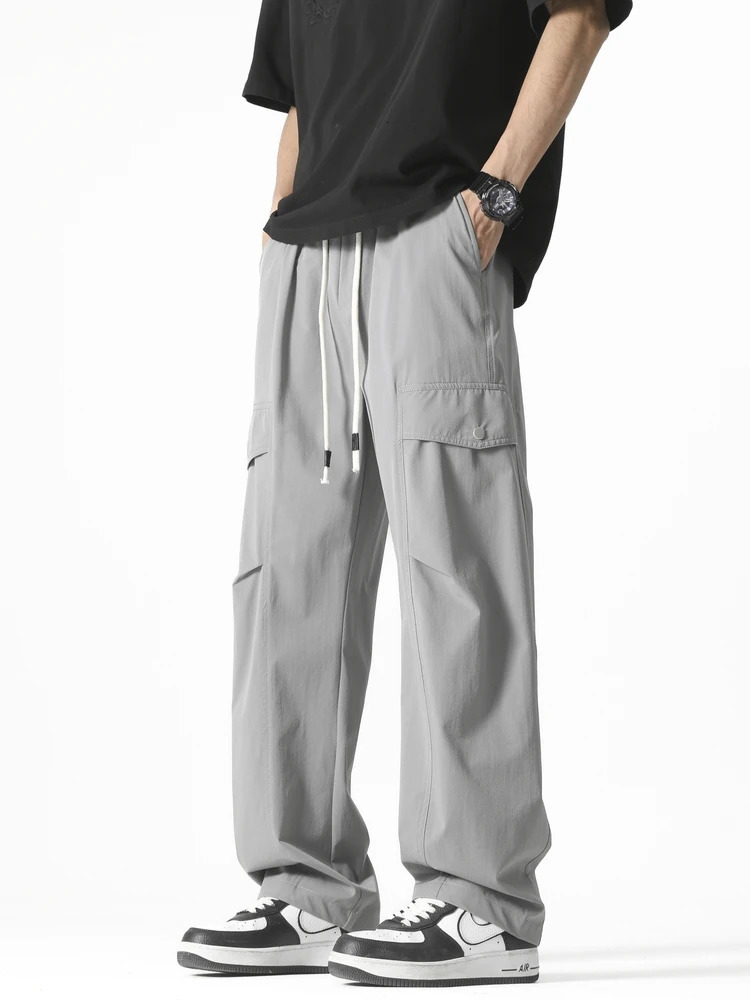 Mens straight casual pants Korean style multi pocket commodity drawstring wide leg sports outdoor loose fit suitable for mens clothing 250327