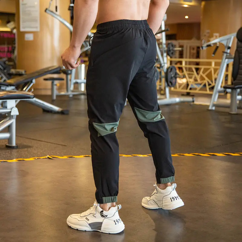 2024 Summer Thin Style Ice Silk Fabric Motion Trousers Man Solid Color Elastic Waist Quick Drying Loose Bodybuilding Sweatpants 250317
