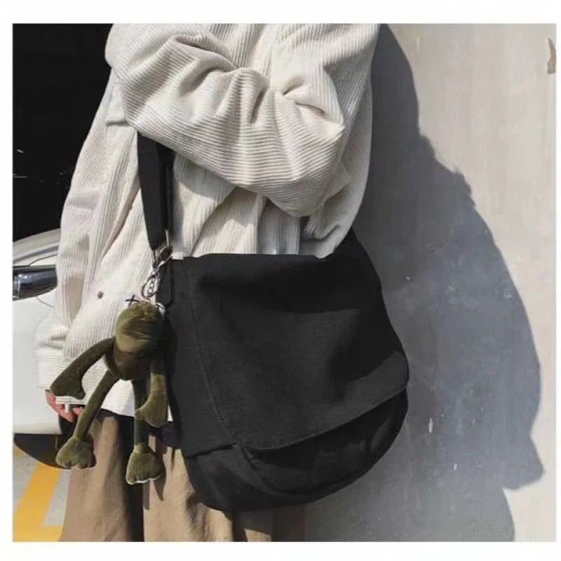 Fashion canvas cross shaped youth bag shoulder womens casual large organizer outdoor messenger with pendant for men 250326