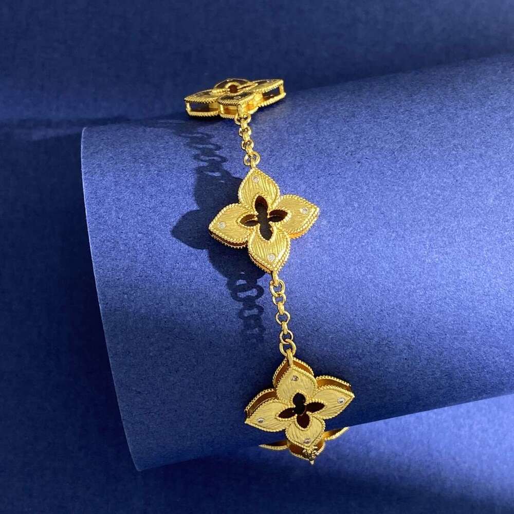 New Italian style four leaf inlaid with small white dia, metal brushed hollow out, carved and engraved five wer bracelet