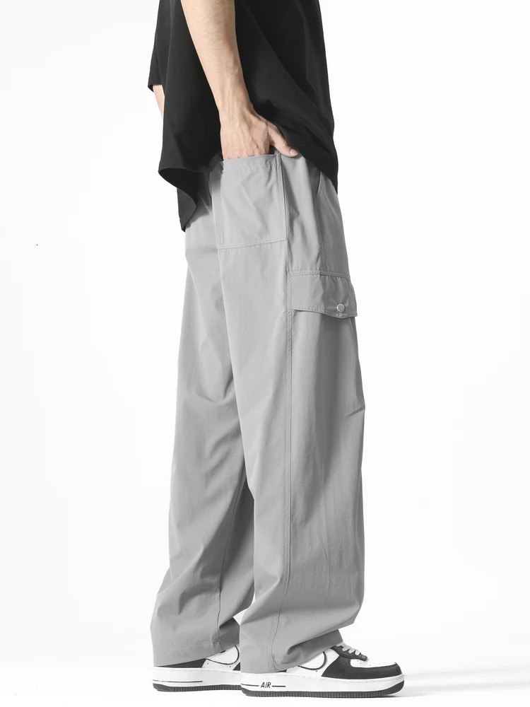 Mens straight casual pants Korean style multi pocket commodity drawstring wide leg sports outdoor loose fit suitable for mens clothing 250327