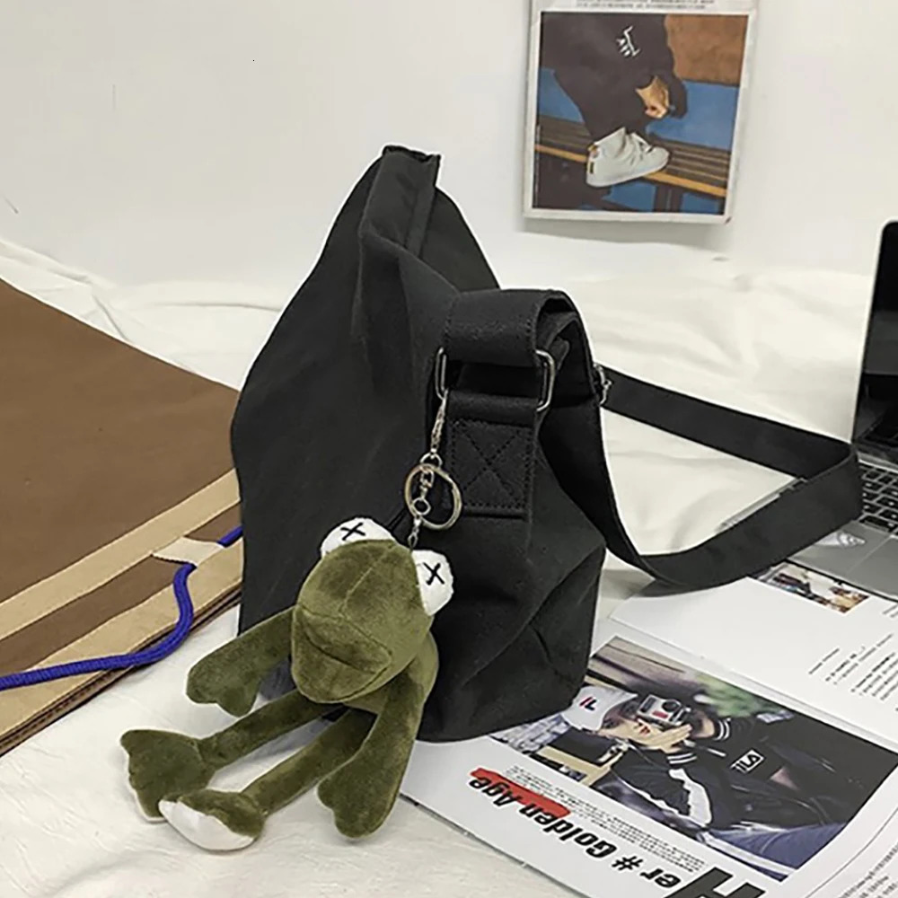 Fashion canvas cross shaped youth bag shoulder womens casual large organizer outdoor messenger with pendant for men 250326