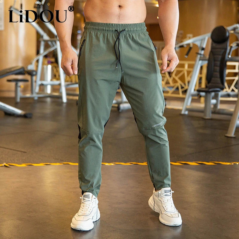 2024 Summer Thin Style Ice Silk Fabric Motion Trousers Man Solid Color Elastic Waist Quick Drying Loose Bodybuilding Sweatpants 250317