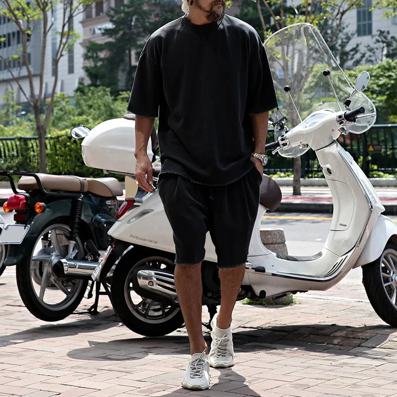 Crossing the border between Europe and United States with casual mens clothing in solid color loose short sleeved simple street trend style set 250326