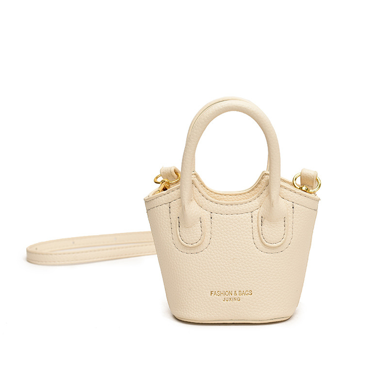 Hot selling solid color all-match lychee print PU girl crossbody carrying mini change lipstick accessory bucket bag