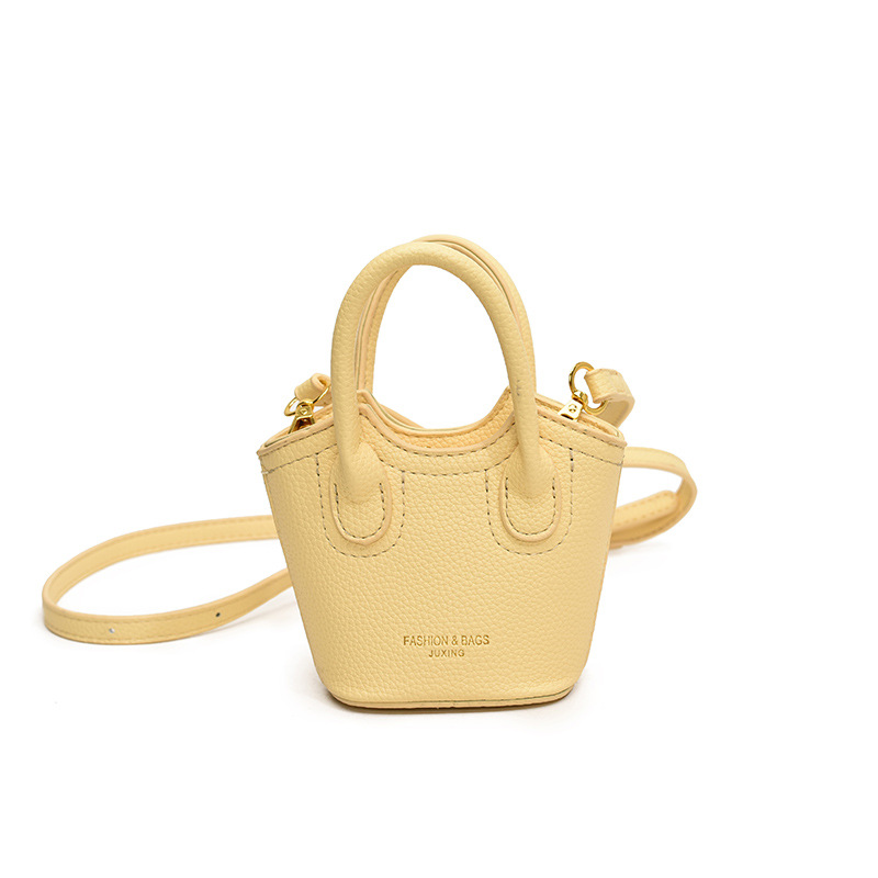Hot selling solid color all-match lychee print PU girl crossbody carrying mini change lipstick accessory bucket bag