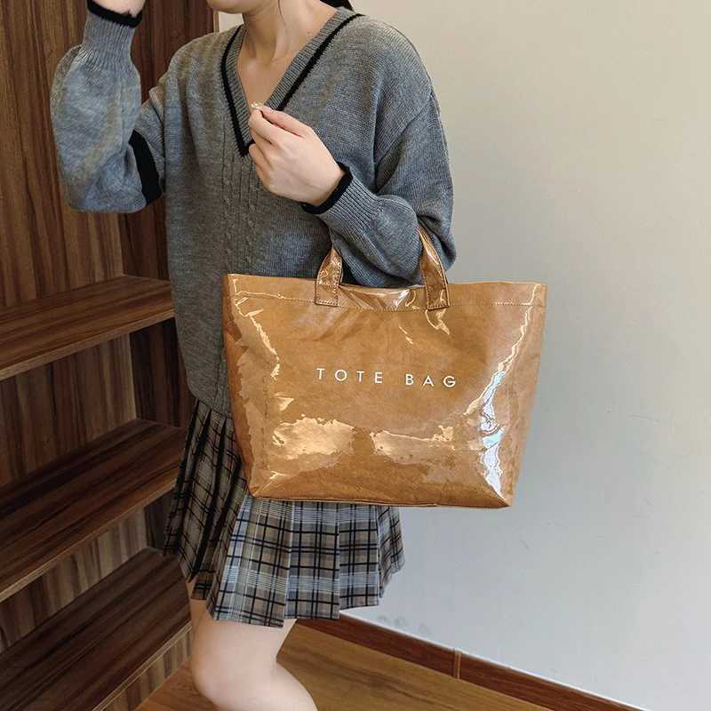 Solid color handbag PVC kraft paper large capacity homeless handbag womens casual shopping letter printed top handle handbag Z250328