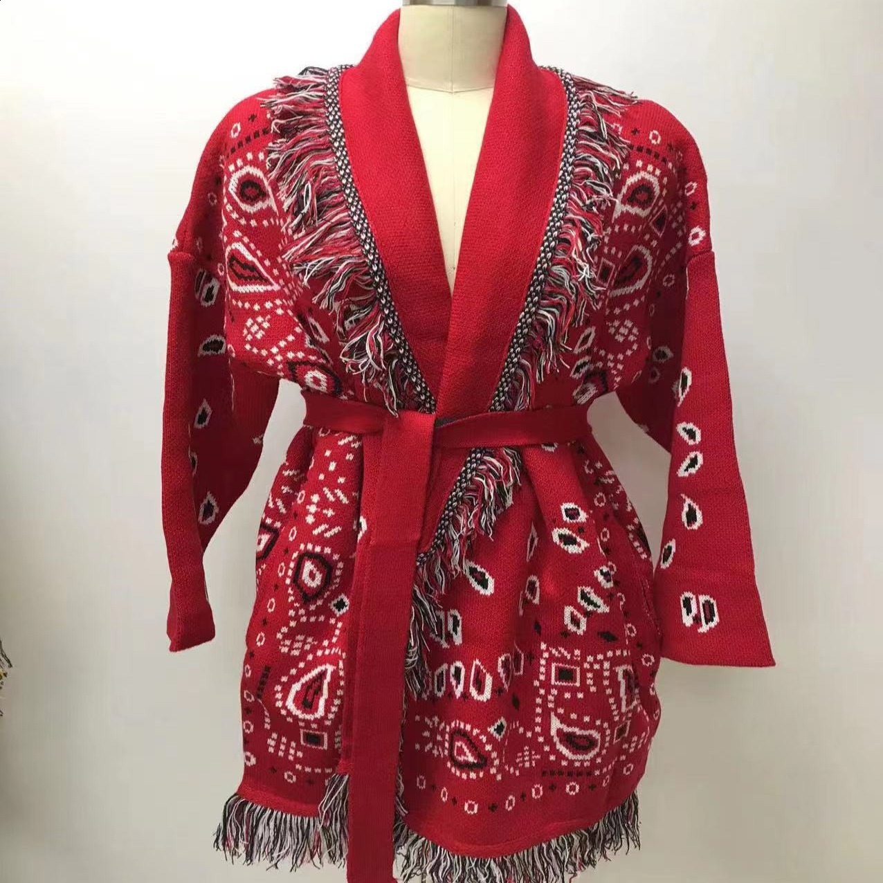 Autumn and winter thick tassel jacquard mid length cardigan womens loose color blocked lapel sweater jacket 230324