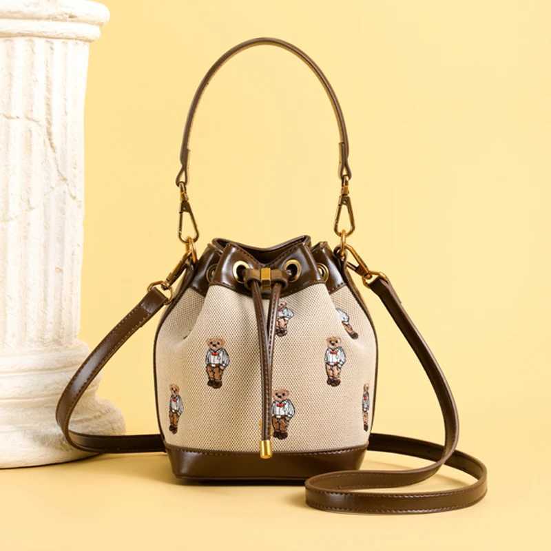 Designer bag Fashionable womens bucket bag bear embroidery Drstring design fashionable ten font wallet suitable for fashionable couples ideal Y250328