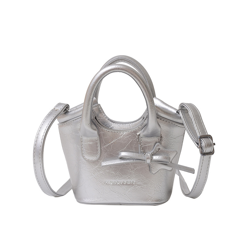 Free shipping hot selling cute bow mini hand bucket bag solid color all matching children's change satchel