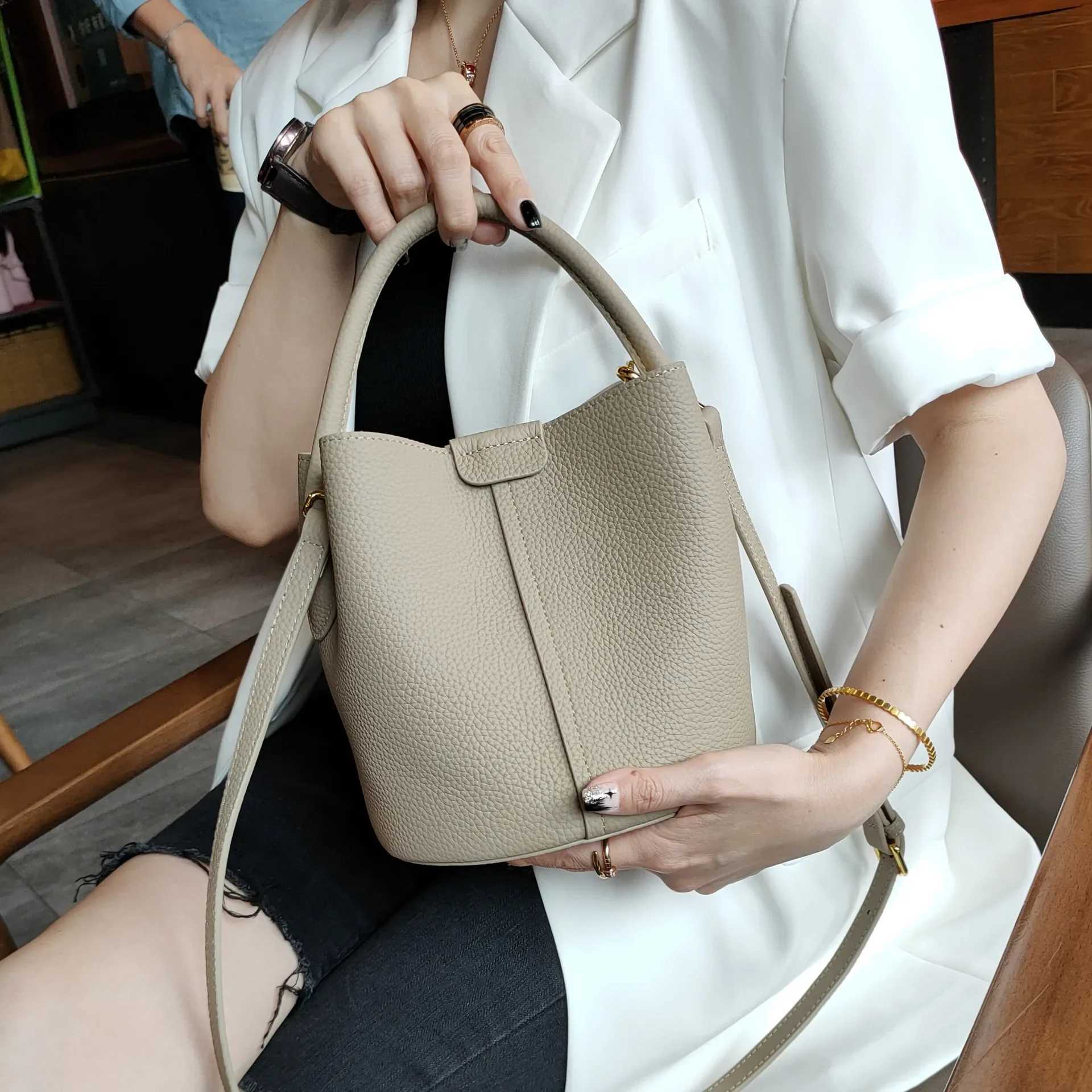 Top Quality Brand High Quality New Style Free Delivery Designer Bag Designer Noble Lavender Purple Round Bucket Small Elegant Denim Leather Shoulder C