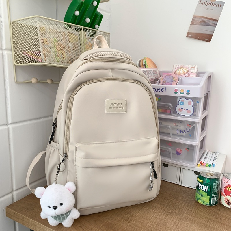 Simple schoolbag female college students junior high school girls solid color all-matching large capacity college backpack 2025s hot