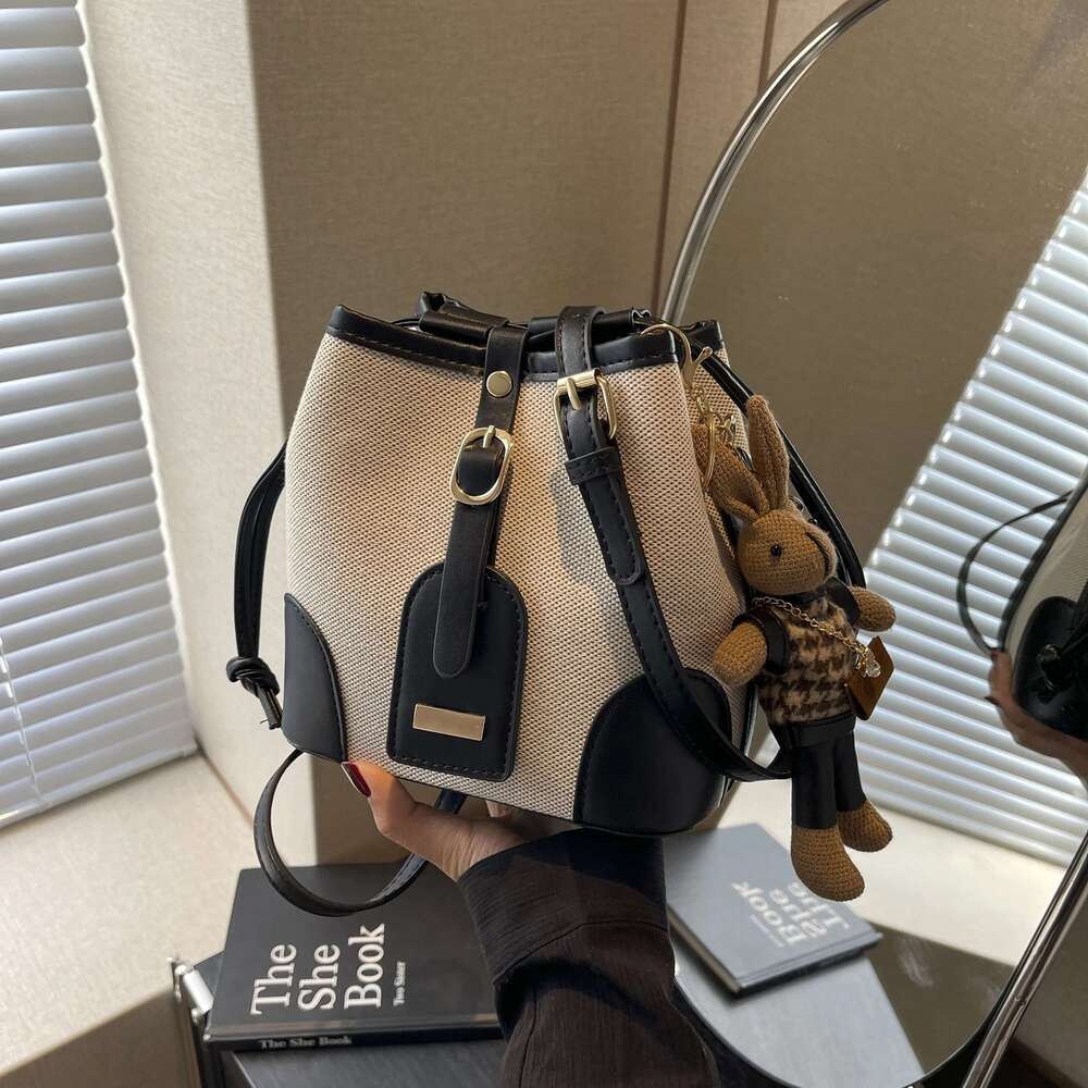 Splice bump color design hasp bucket fashion casual slant shoulder bag (with little rabbit pendant)