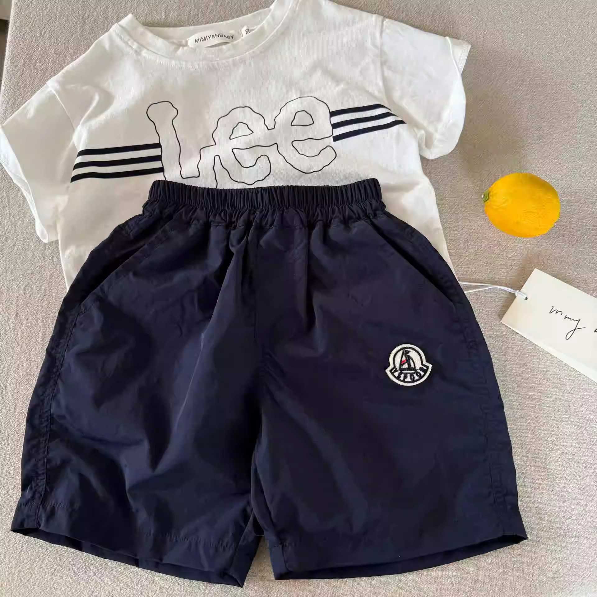 Childrens Shorts Mens Outerwear for Summer 2025 Korean Style Medium and Small Childrens Solid Color Shorts Breathable Baby Five Quarter Pants Womens t