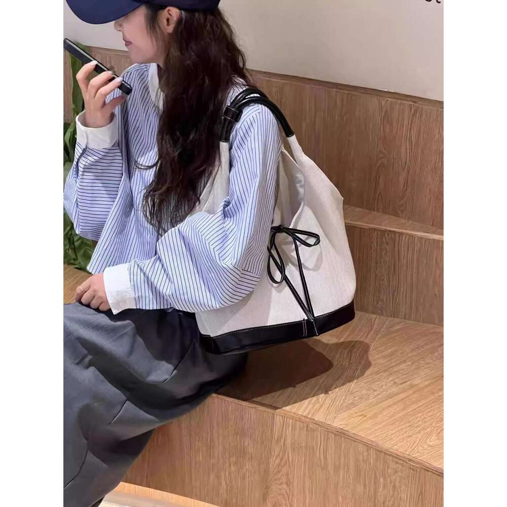 New niche design versatile canvas for women 2025 Korean splicing fashion handbag armpit tote bag