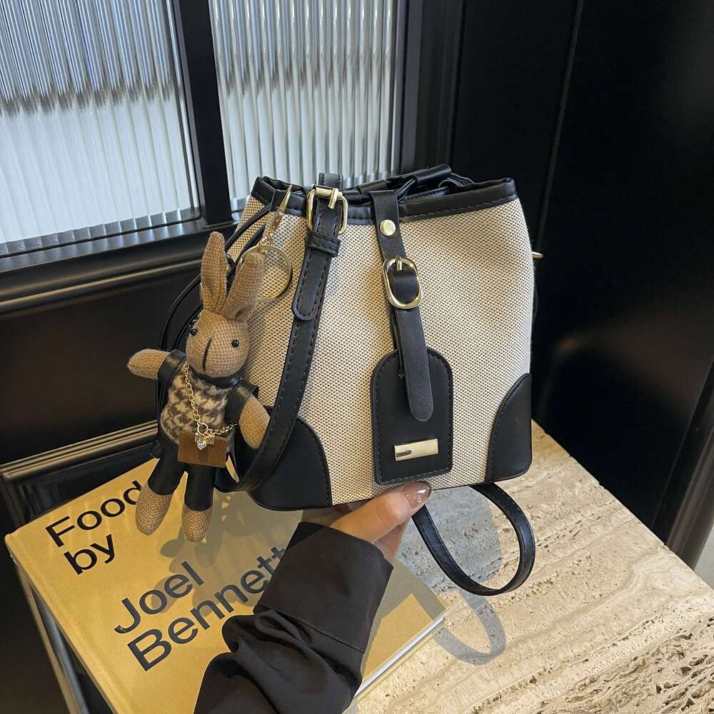 Splice bump color design hasp bucket fashion casual slant shoulder bag (with little rabbit pendant)