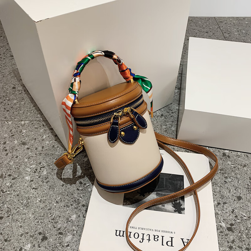 New hot selling niche designer designed cylindrical bag, retro and fashionable hand-held crossbody bucket bag, women's free shipping