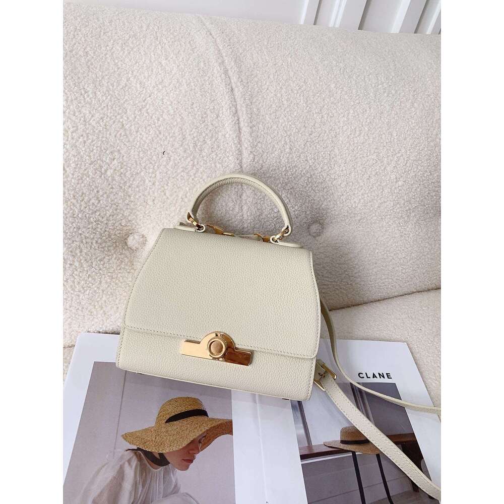 Celebrity style handbag with top layer cowhide round buckle flip cover commuter mailman bag, letter package, small square bag