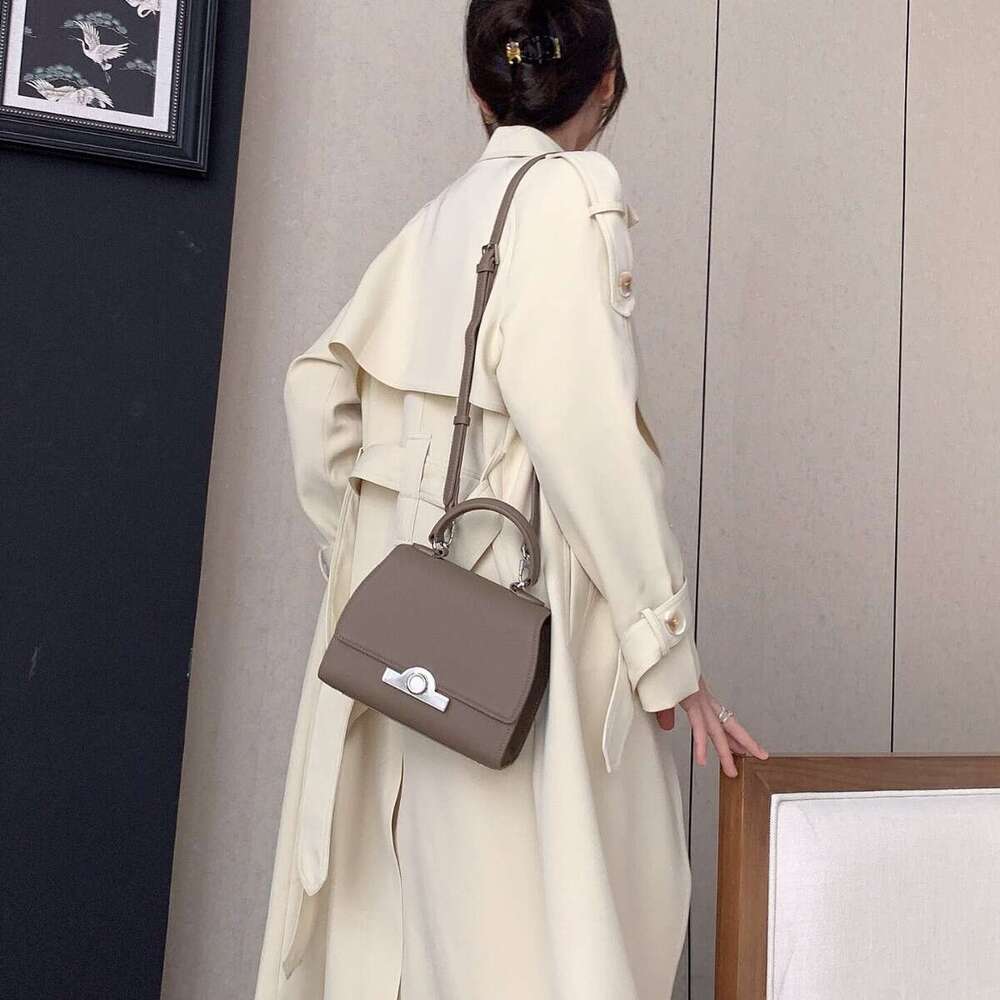 Celebrity style handbag with top layer cowhide round buckle flip cover commuter mailman bag, letter package, small square bag
